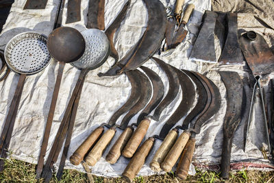 The handmade weapons made of iron are being shown at a shop in the tribal fair in  india