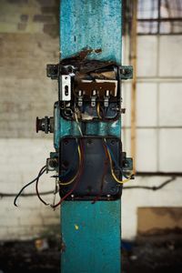 Close-up of pipes against blue wall