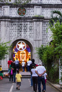 Rear view of people walking in church