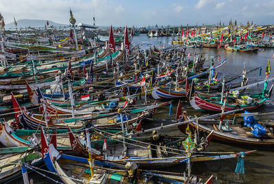 Fishing boats moored at harbor