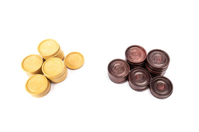 High angle view of coins on white background