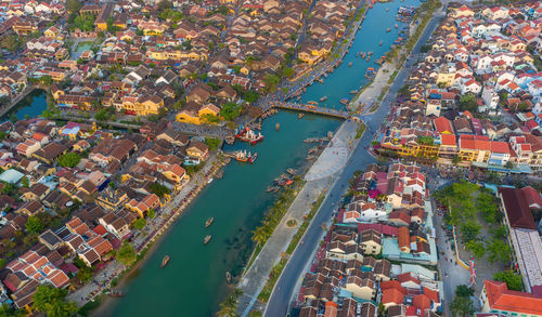 High angle view of river amidst buildings in city