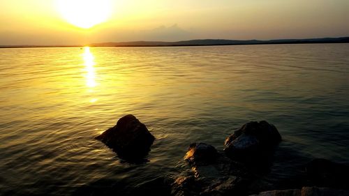 Scenic view of sunset over river