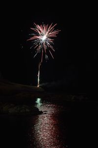 Firework display over sea