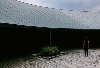 Full length of people walking on tiled floor