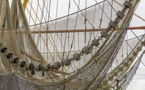 Close-up of sailboat in sea against sky