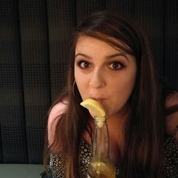 Portrait of young woman eating food