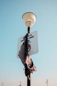 Low angle view of street light against sky