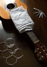High angle view of guitar on table