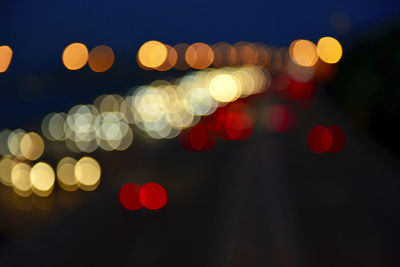 Defocused image of illuminated lights at night