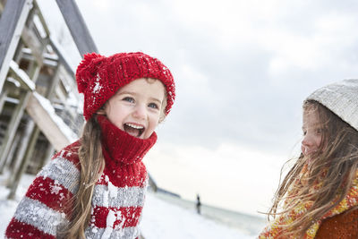 Sisters having fun in winter