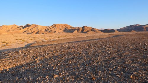 Scenic view of desert against clear sky