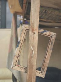 Close-up of birdhouse on wooden plank