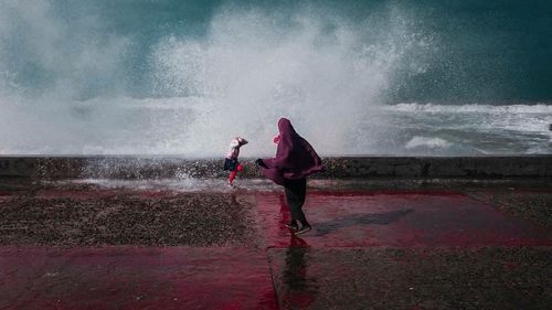 People enjoying at sea shore