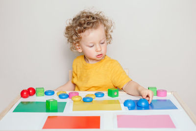 Cute boy playing with toy