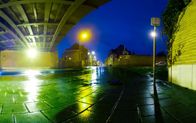 Illuminated street lights in city at night