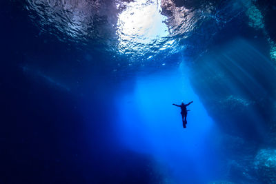 Low angle view of person swimming in sea