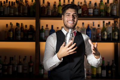 Portrait of businessman standing in store