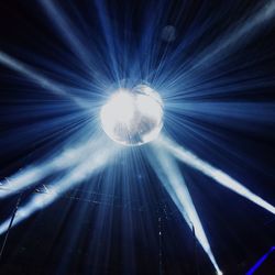 Low angle view of illuminated lights at night