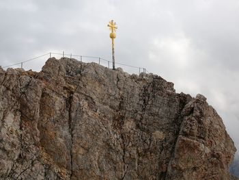 Low angle view of rock formation against sky