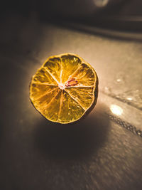 Close-up of lemon slice on table