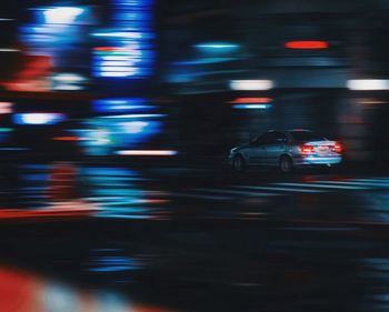 Blurred motion of vehicles on road at night