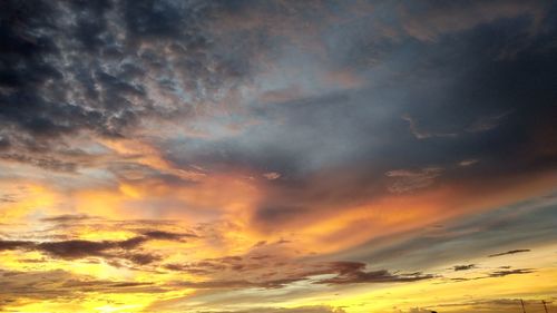 Low angle view of dramatic sky during sunset