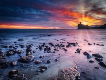 Scenic view of sea against sky during sunset