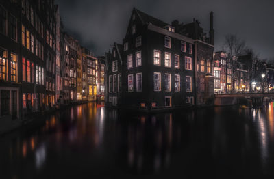 Reflection of illuminated buildings in water at night