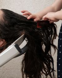 Close-up portrait of woman holding camera