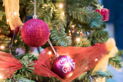 High angle close-up of bauble hanging on christmas tree