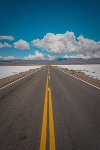 Surface level of empty road against sky