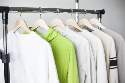 Close-up of clothes hanging on rack