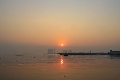 Scenic view of sea against sky during sunset