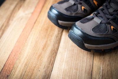 Close-up of hiking boots on wooden table