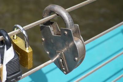 Close-up of padlocks on metal