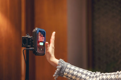 Midsection of woman photographing