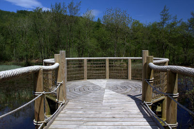 A timber built platform over a lake, mabie forest, dumfries, scotland.