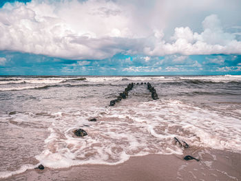 Scenic view of beach against sky