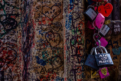 Full frame shot of graffiti and love padlocks on wall