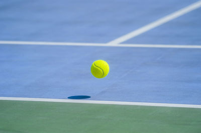 Close-up of yellow ball in pool