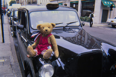 View of stuffed toy car on street in city