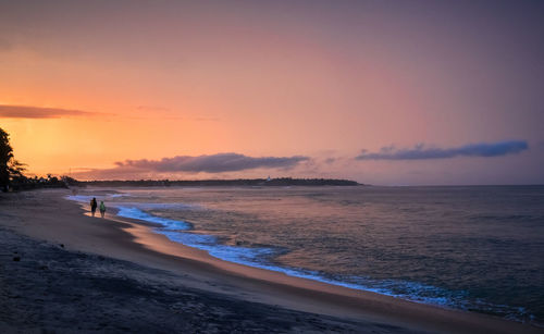 Scenic view of beach against sky during sunset, arugam bay, sri lanka