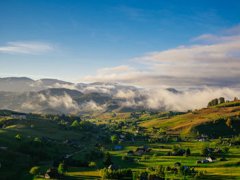 Scenic view of landscape against cloudy sky