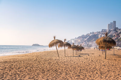 Scenic view of beach against clear sky