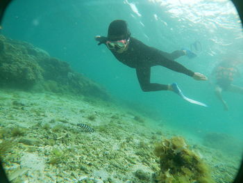 Man swimming in sea