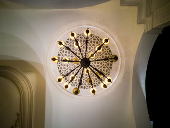 Low angle view of illuminated chandelier