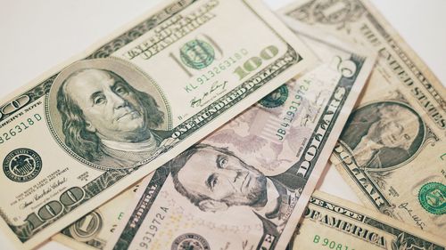 Close-up of us paper currency on table