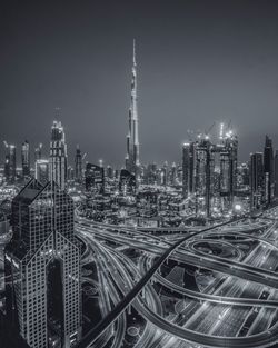 Aerial view of city lit up at night