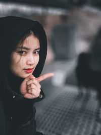 Portrait of woman standing outdoors